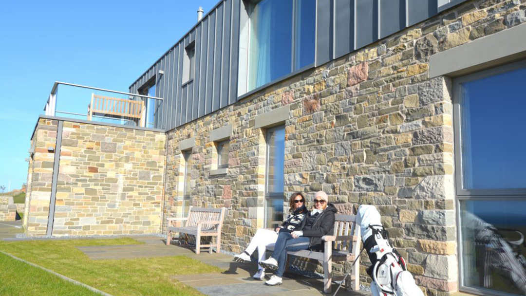 Golf Lodge putting area with chairs